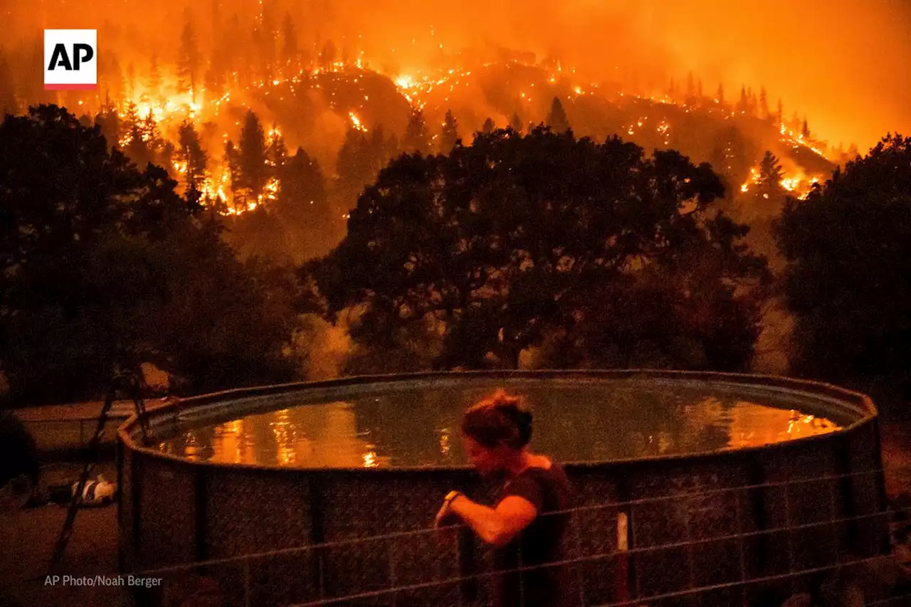 Heat, wind threaten to whip up growing Western wildfires