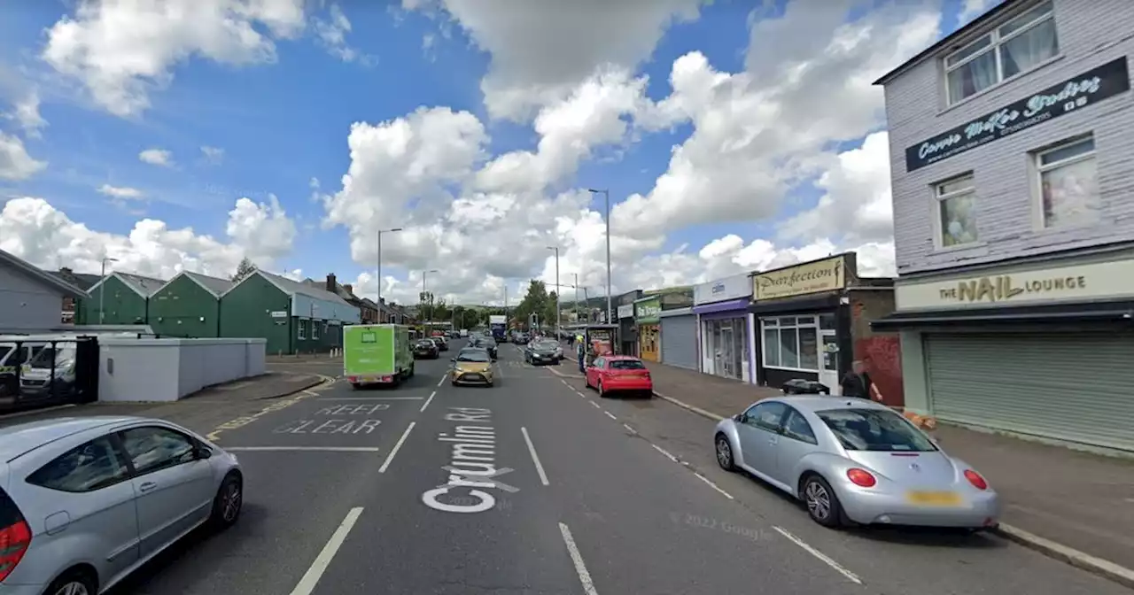 Man arrested after crash between motorbike and parked car in North Belfast