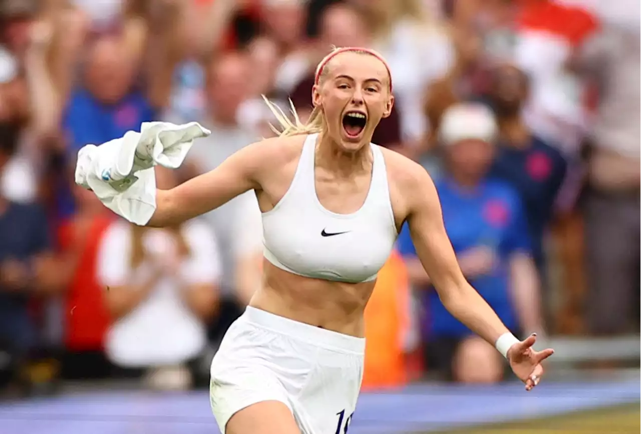 England hero Chloe Kelly swings top above her head after Germany winner