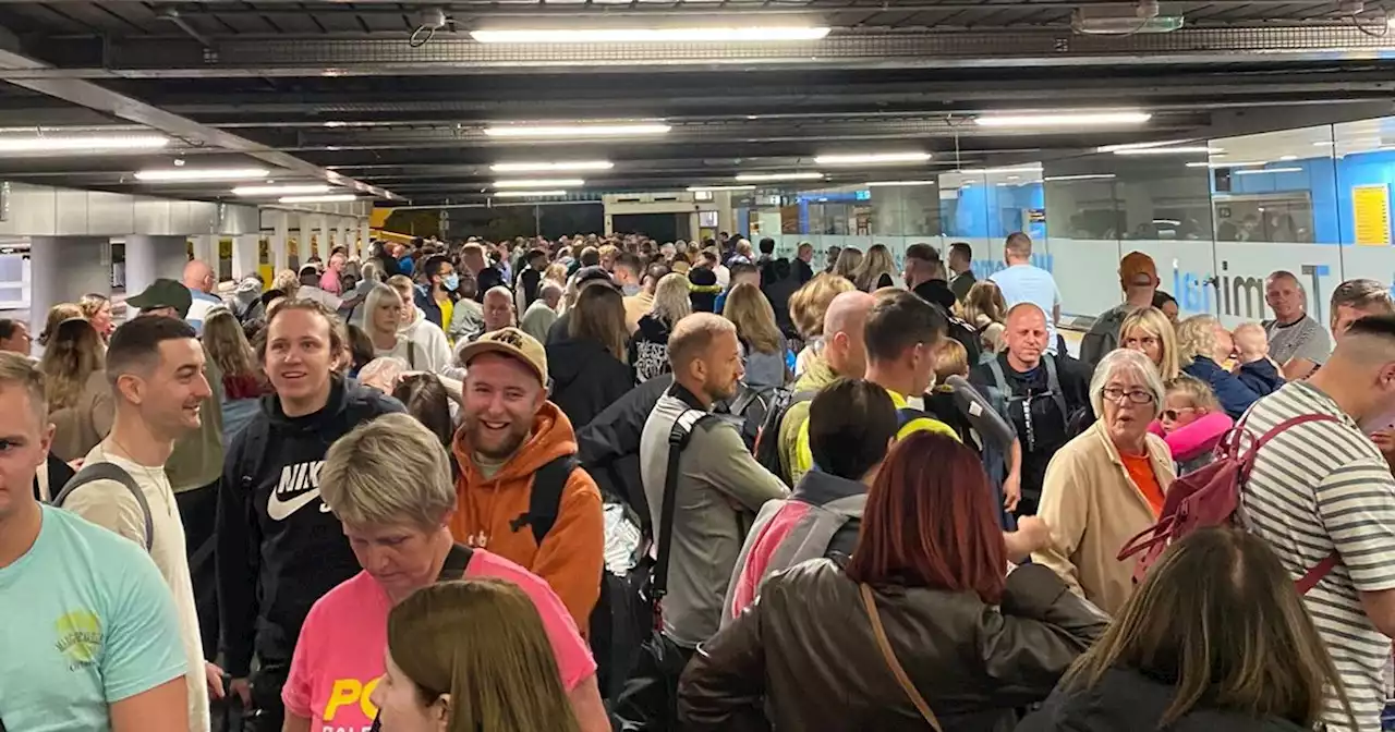 'Utter shambles' at Manchester Airport as queues stretch back to the car park