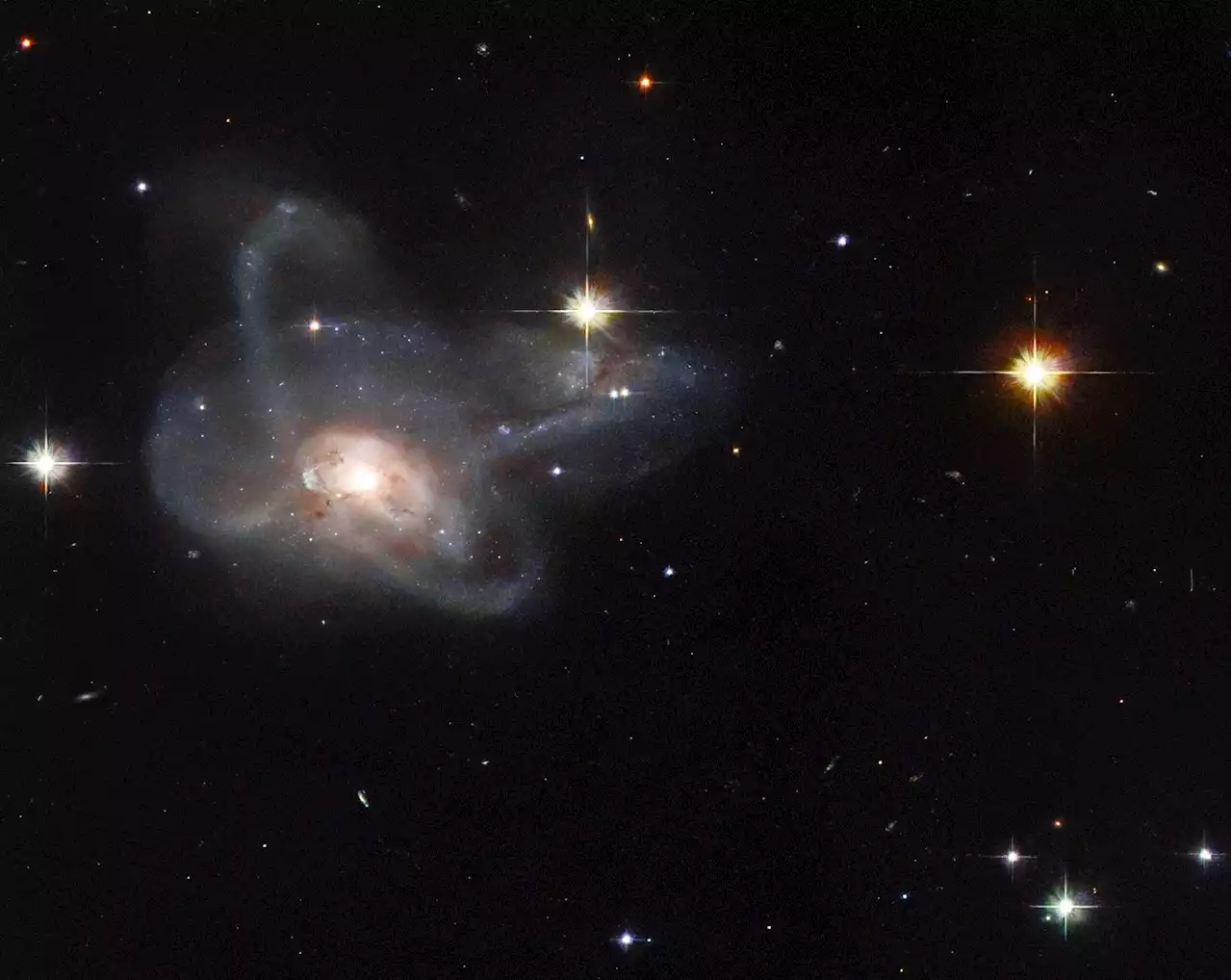 Hubble Spies a Galactic Gem: Unusual Multi-Armed Galaxy Merger