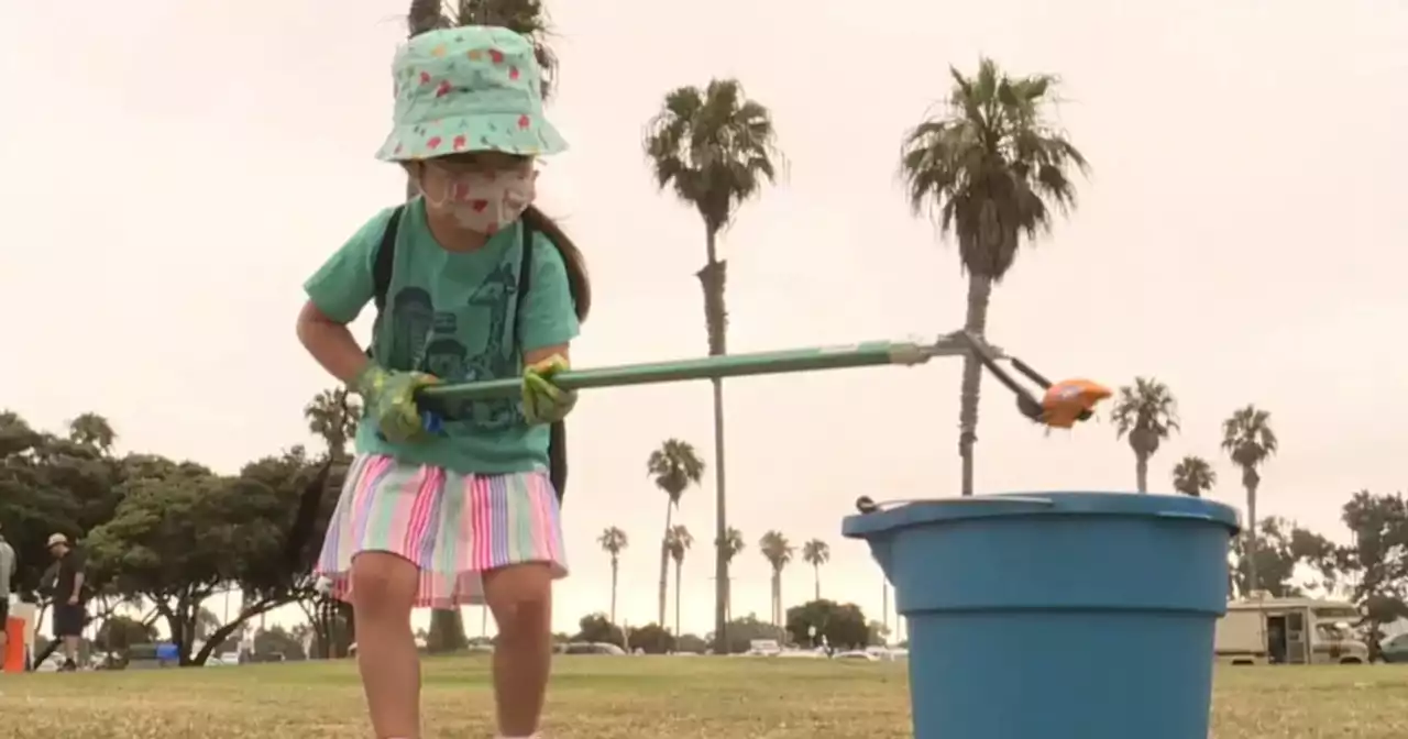 Volunteers cleanup trash following holiday beach crowds