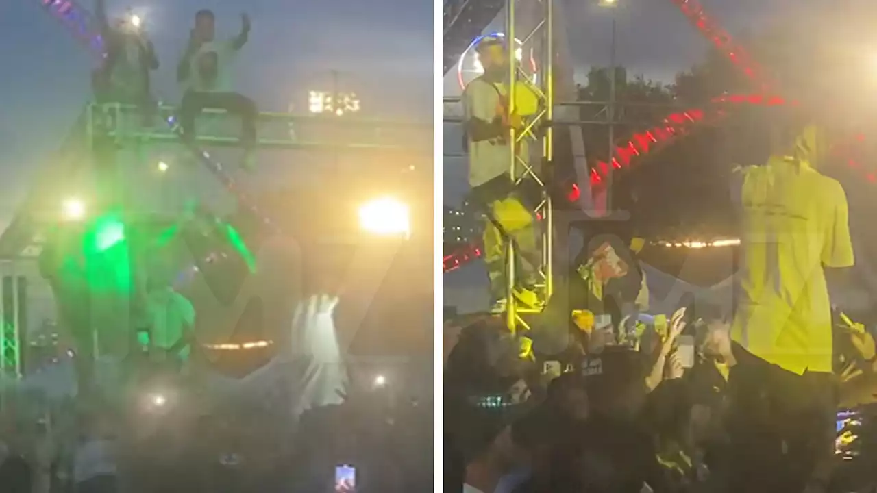 Travis Scott Stops Concert and Orders Fans Dangling from Truss to Get Down