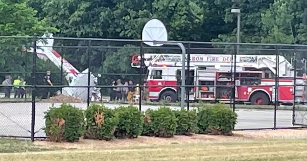 2 people hospitalized after small plane crashes behind Akron middle school