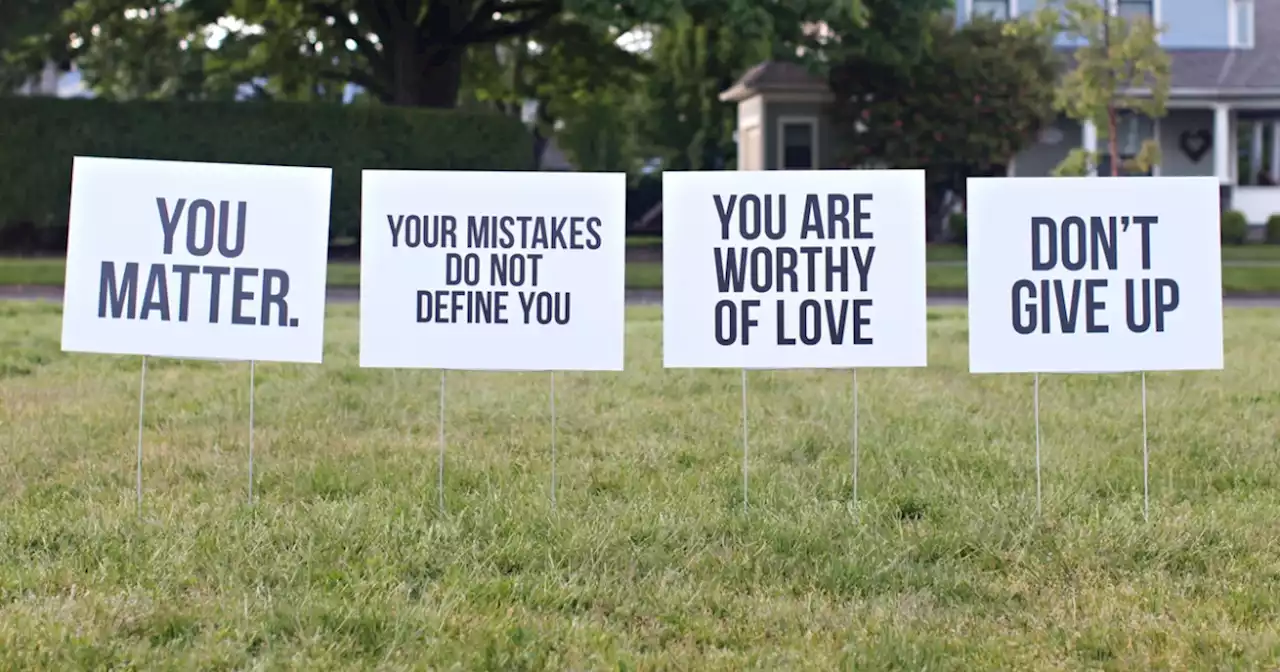 Yard signs bring messages of hope in Liberty Wells