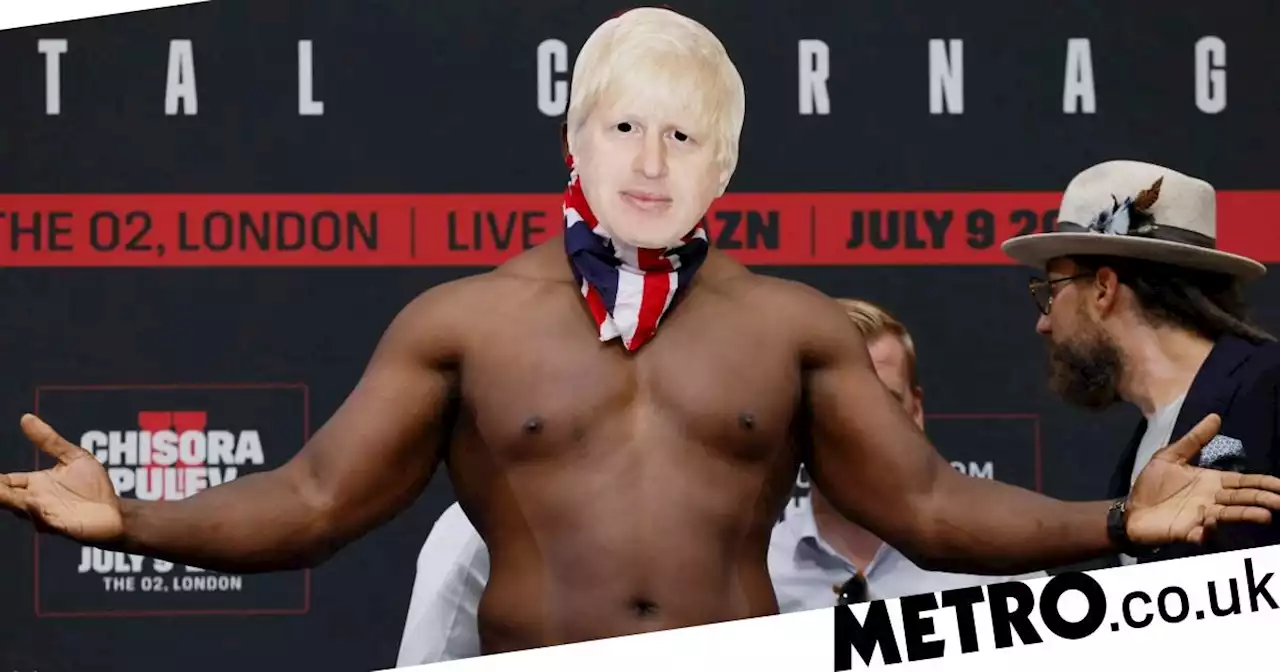 Derek Chisora poses in Boris Johnson mask at weigh-in for Kubrat Pulev fight