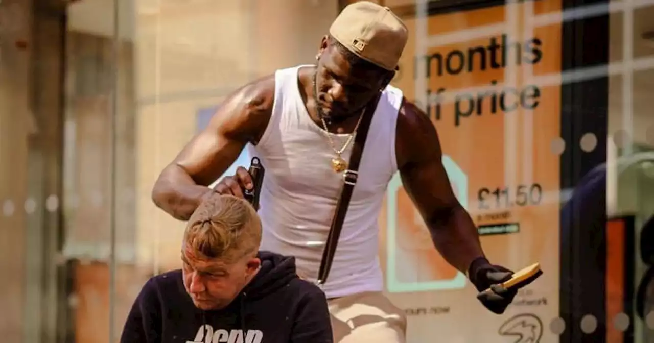 Man cutting people's hair in city says 'you have to bless others'