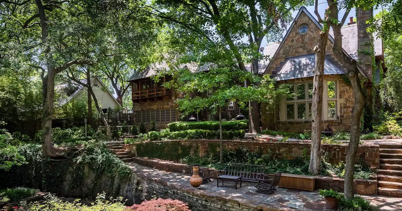 Just beyond a creek sits this Tudor-style home in University Park