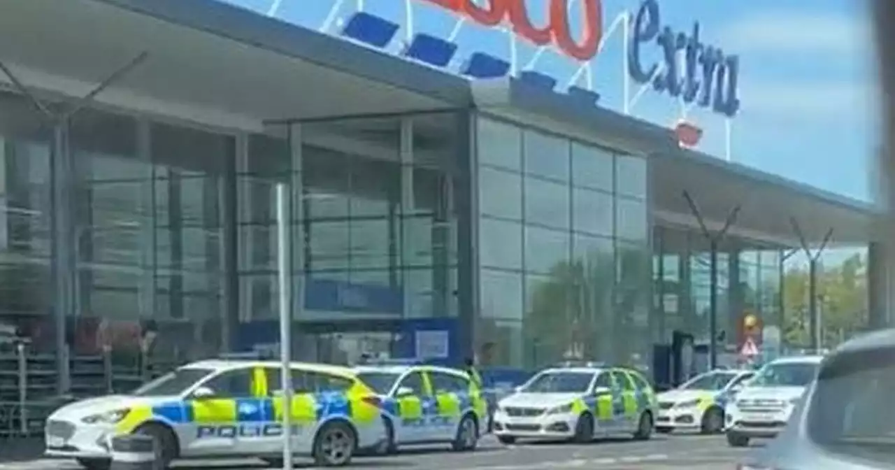 Tesco Rutherglen 'stabbing' as man arrested and woman hospitalised