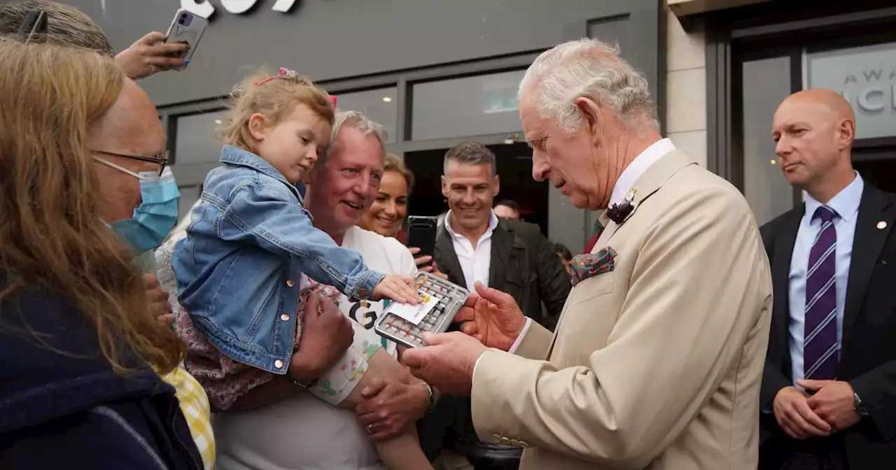 Prince Charles showcases rarely seen soft side as he befriends two toddlers