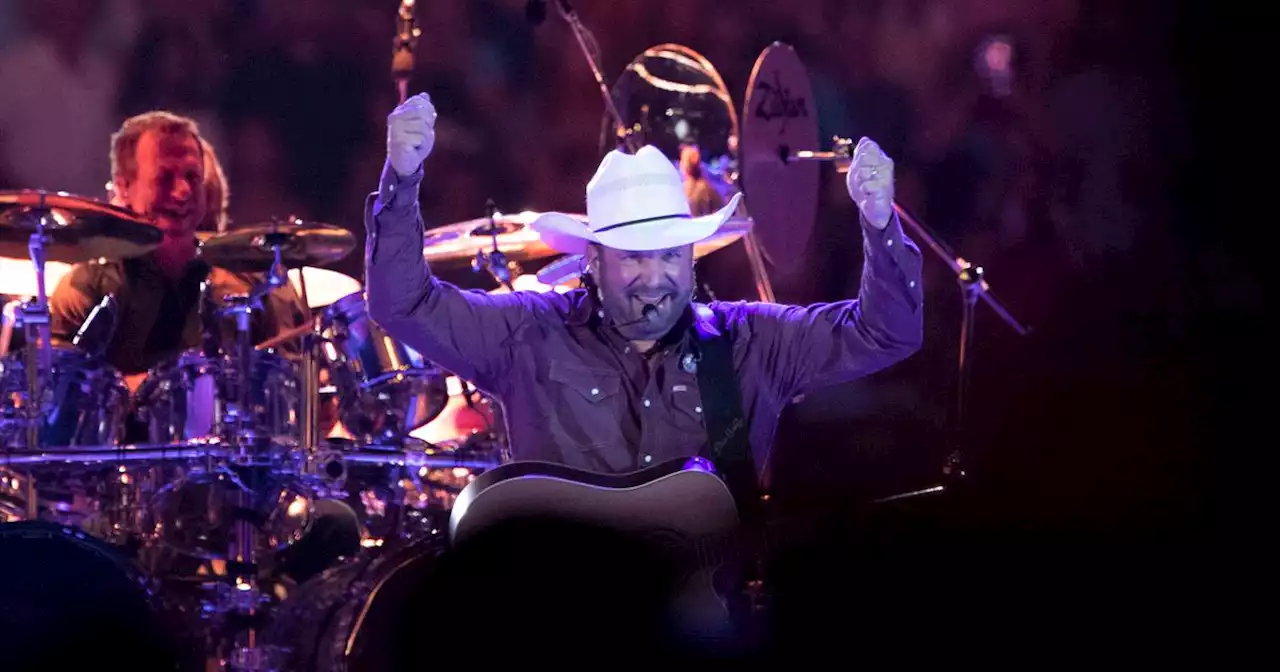 Sweat-soaked Garth Brooks turns up the heat at Arlington concert