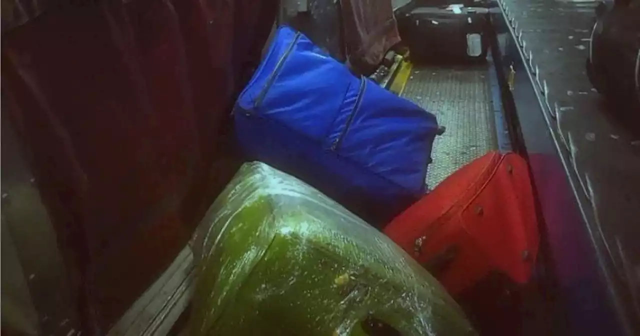 Manchester Airport passengers crawl through conveyor belts to get bags