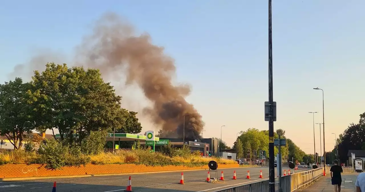 Fire crews rush to blaze near petrol station