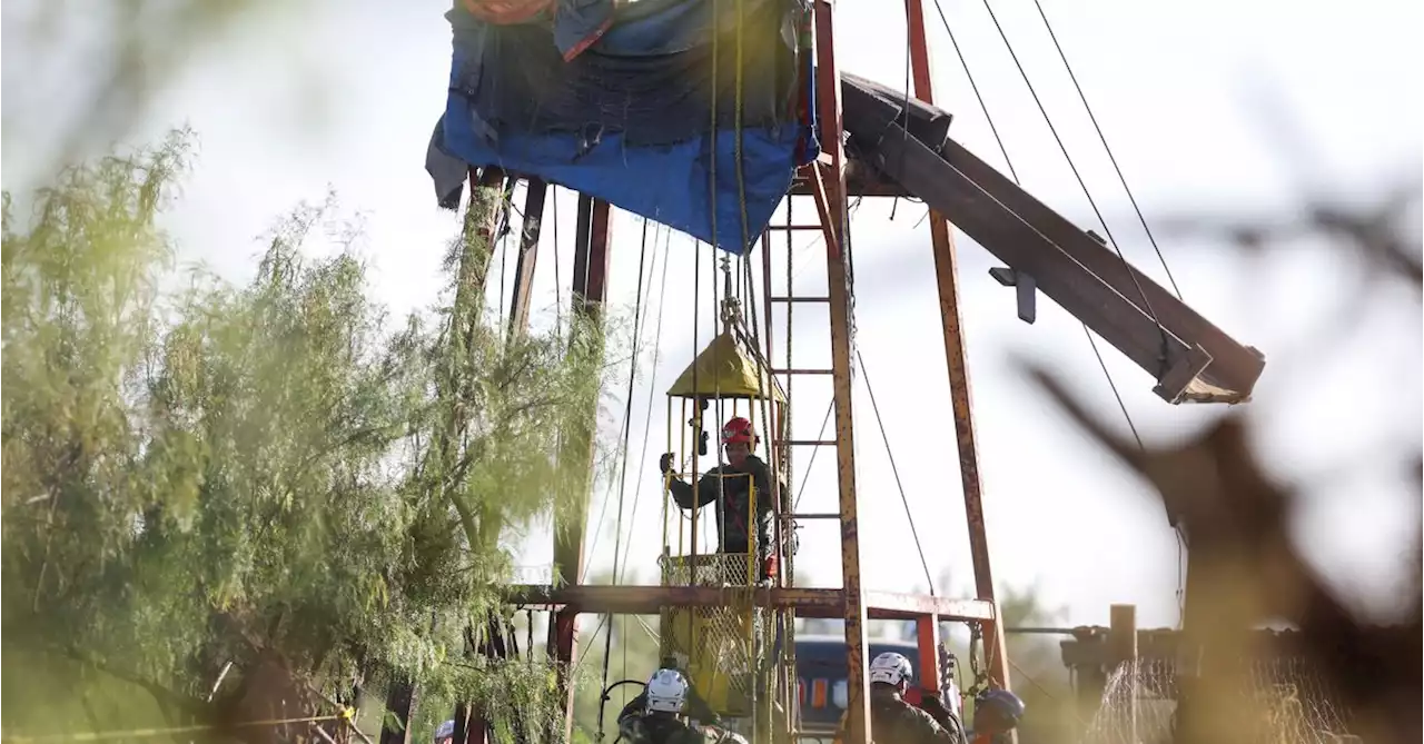 Darkness and debris impede rescue effort at flooded Mexico mine