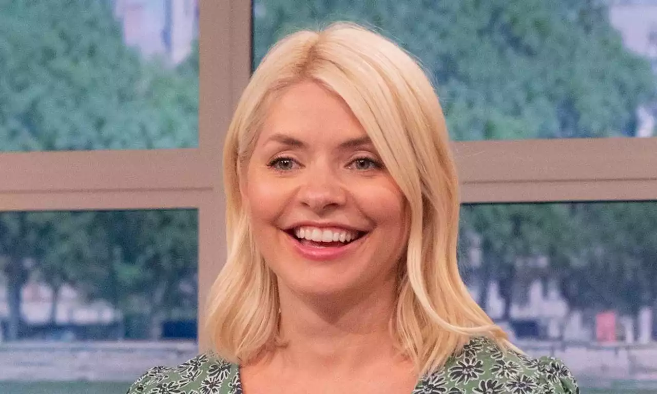 Holly Willoughby is a vision in black diamante bikini with touching twist