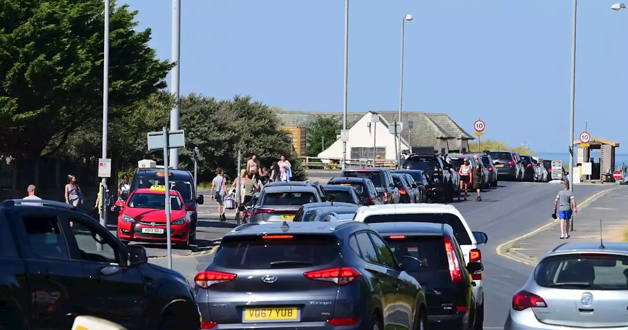 Cars stuck in miles of tailbacks as families descend on coast to enjoy heatwave