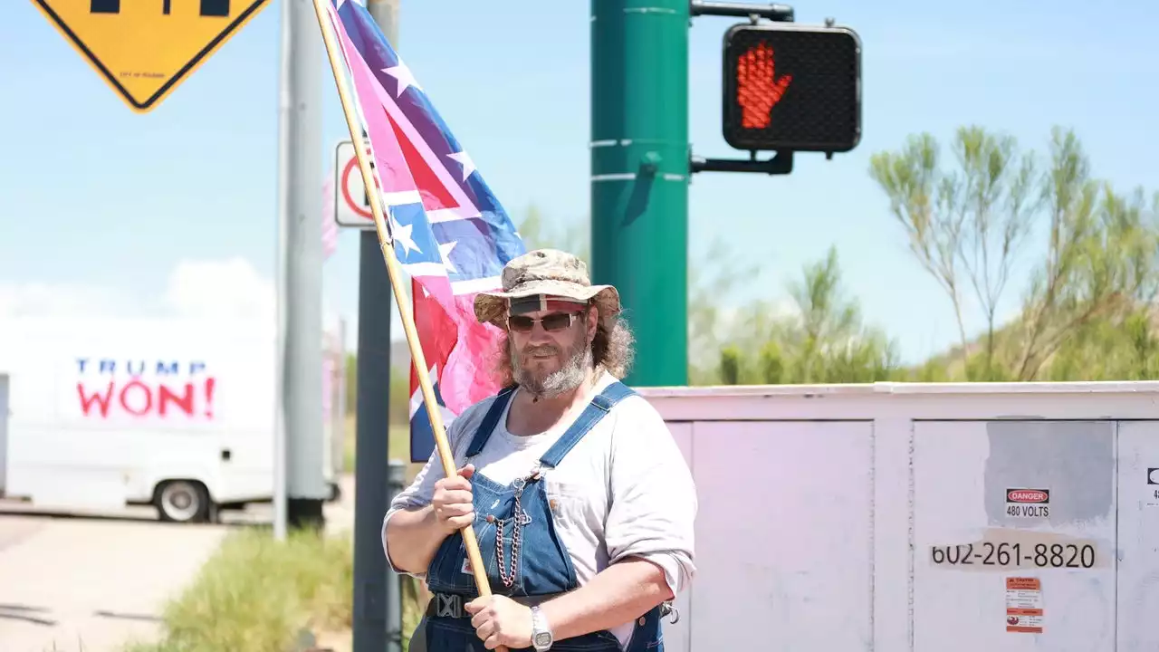 Armed Trump supporters protest outside of FBI office in Phoenix following Mar-a-Lago probe