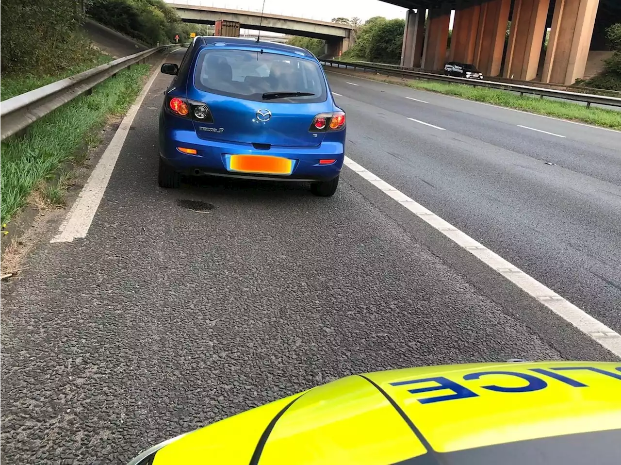 Driver caught 'snoring merrily away' on the M6 near Bamber Bridge with full-beam headlights and engine running