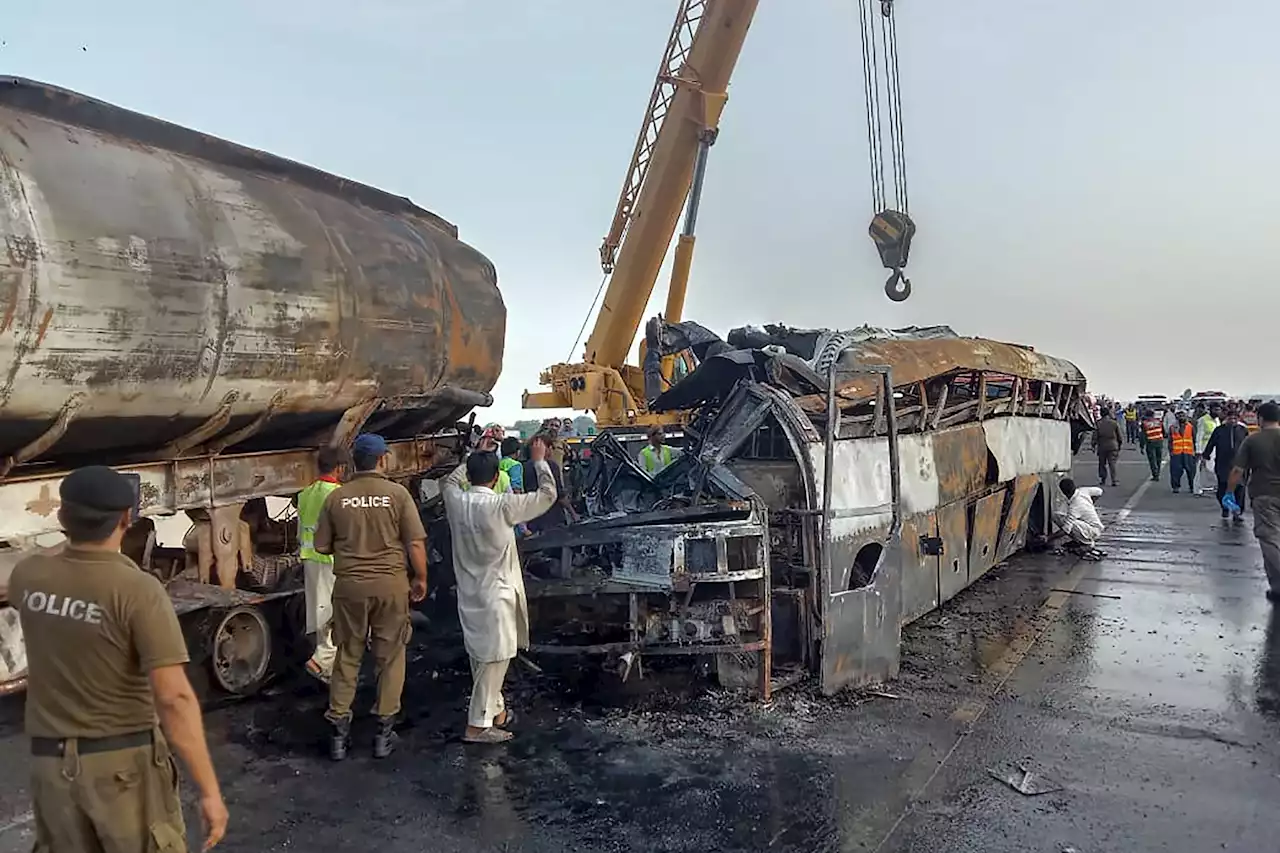 Bus rams into fuel truck in eastern Pakistan, killing 20