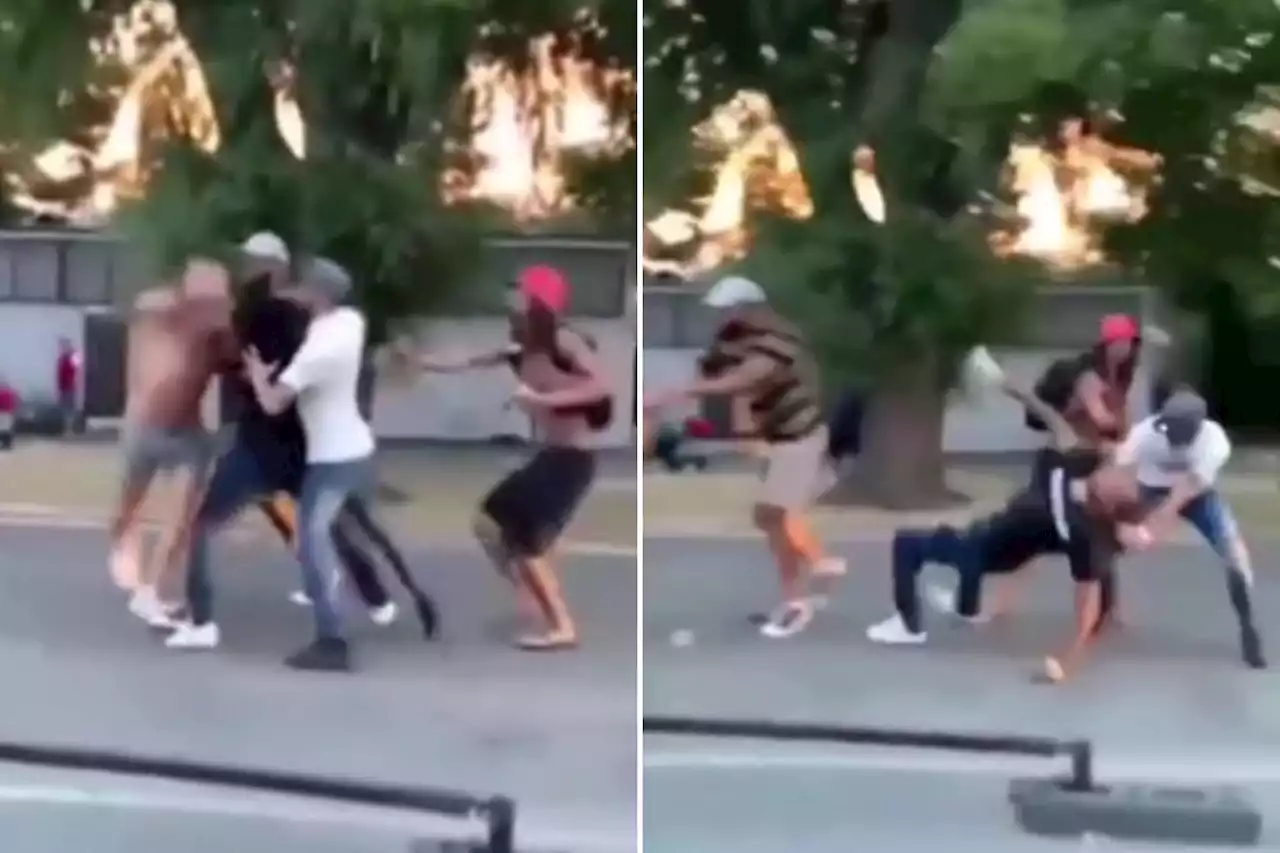 Moment topless men throw punches at each other in front of shocked families