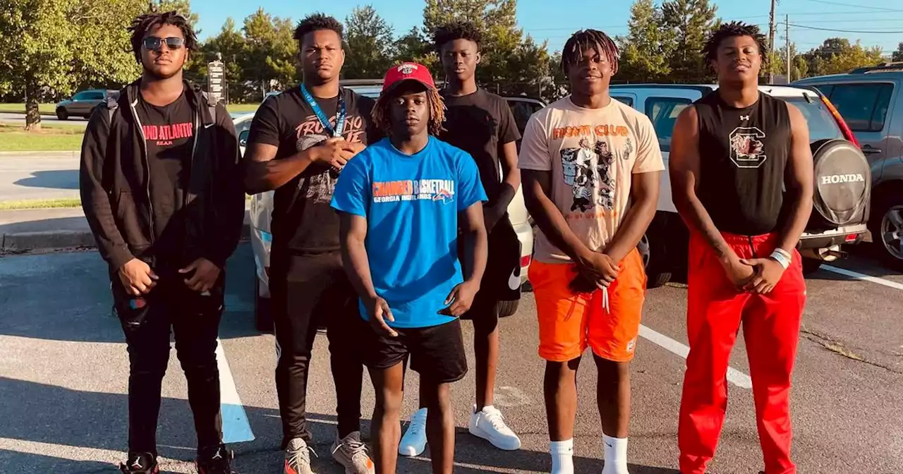 Georgia high school football players save woman stuck in car after crash