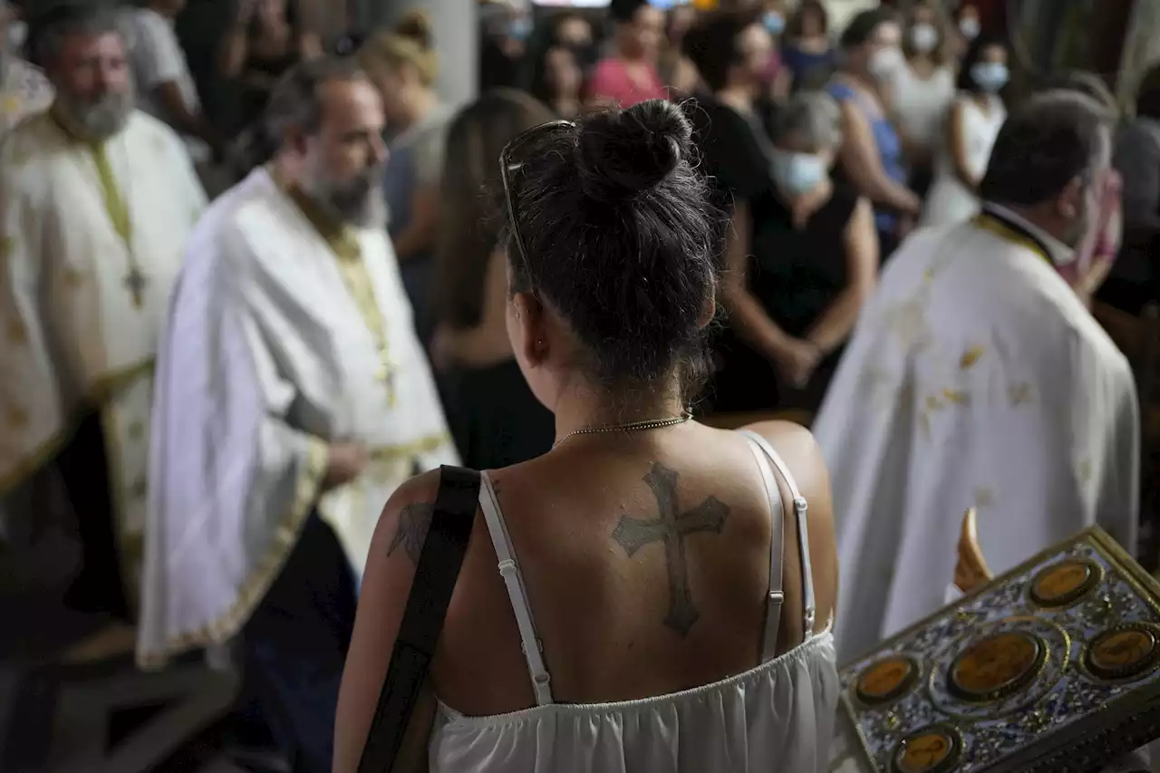 AP PHOTOS: Spiritual, material mix at Greek mid-August feast