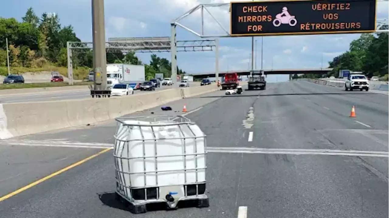 Motorcyclist in life-threatening condition after crashing into fallen container on Highway 401 | CBC News