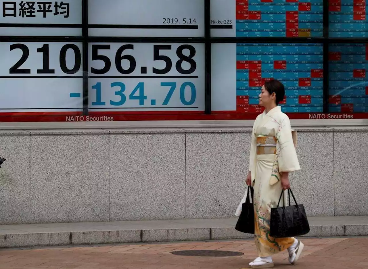 Asian stocks solid and kiwi jumps on RBNZ rate hike
