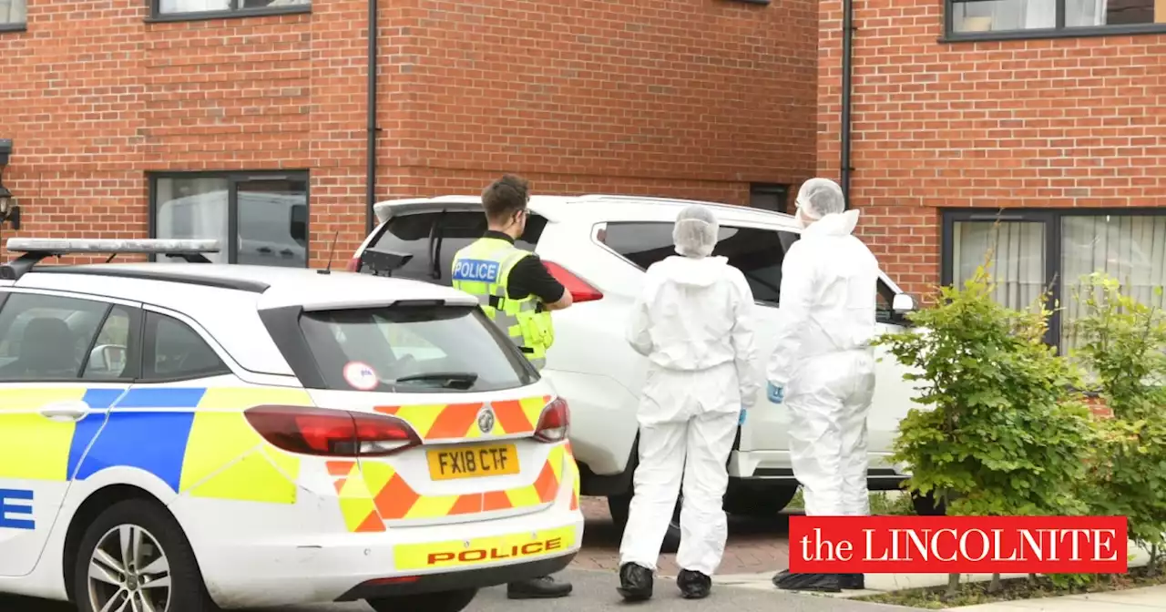 Forensics arrive at Lincoln home where woman found with stab wounds