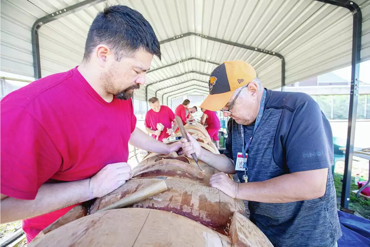 Men in custody find healing and life skills while carving totem pole