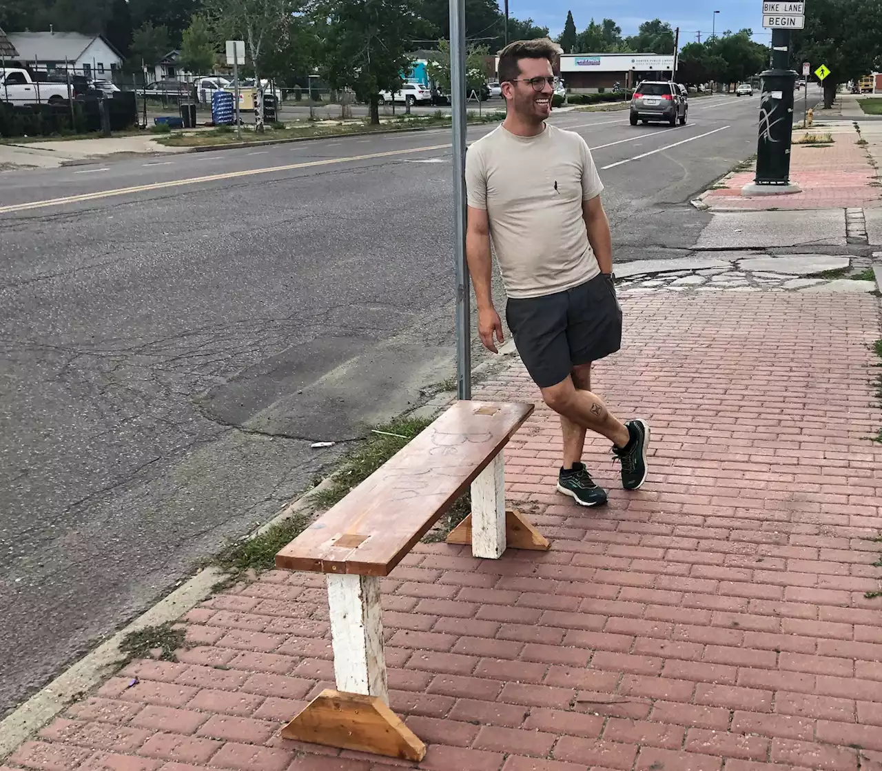 He saw a woman sitting in the dirt at a bus stop. So he began making benches.