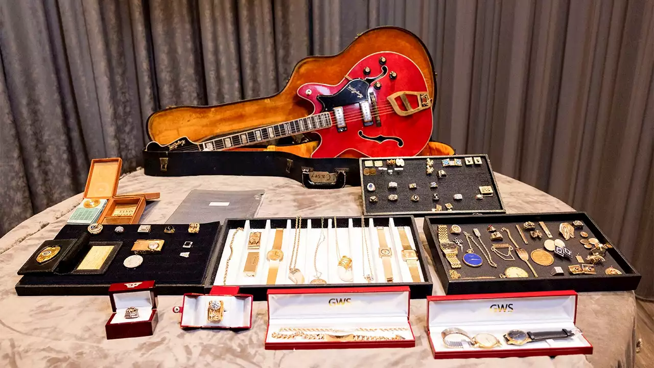 Elvis Presley jewelry, guitar up for auction