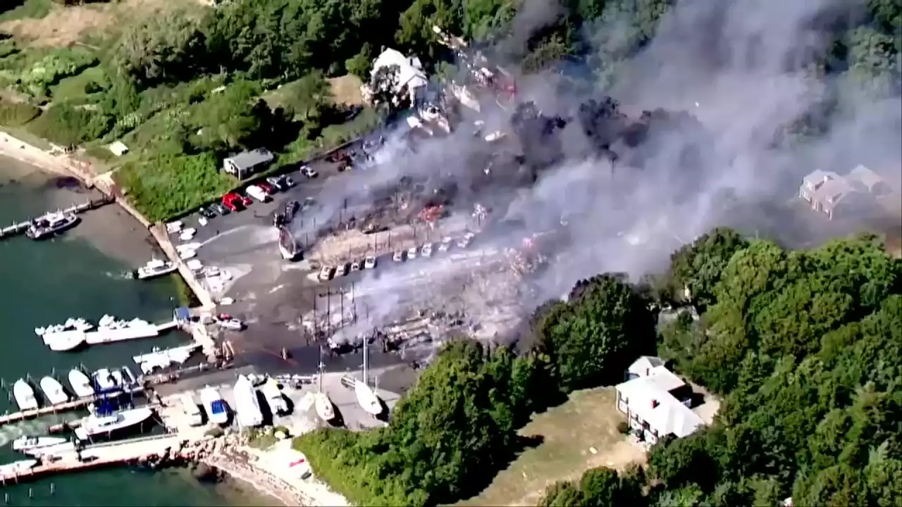 Massachusetts boatyard fire consumes boats, buildings, vehicles