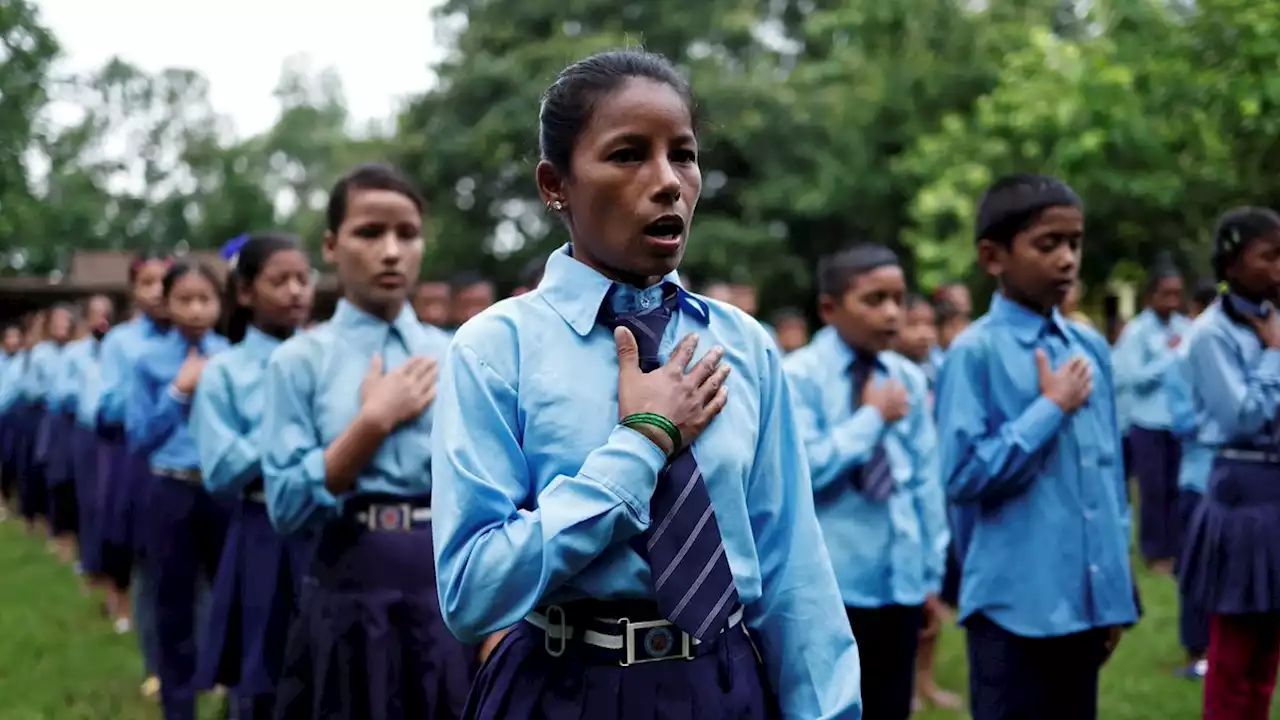 Nepali woman's quest to learn takes her back to school with son