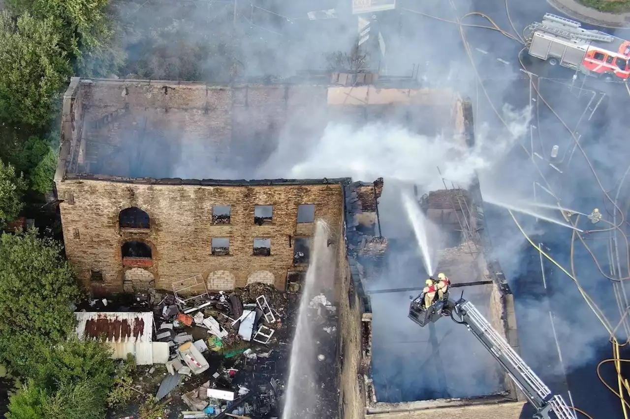 Firefighters continue to put out derelict mill blaze in Accrington as drone footage locates burning gas pipe