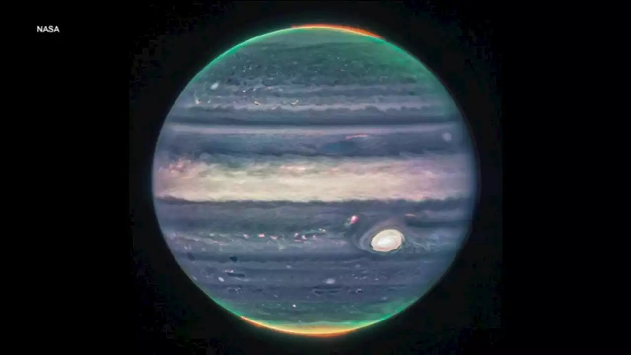 NASA space telescope shows Jupiter's auroras, tiny moons