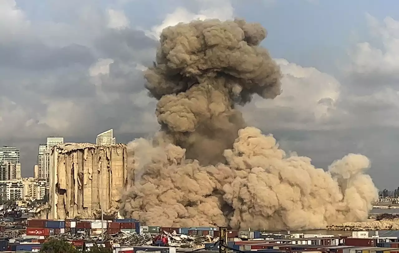 Large section of smoldering Beirut port silos collapses