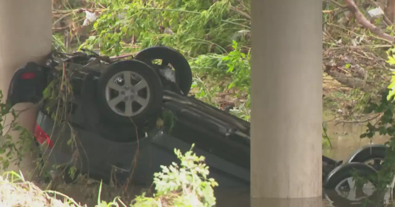 Woman killed after flash flooding sweeps car off bridge