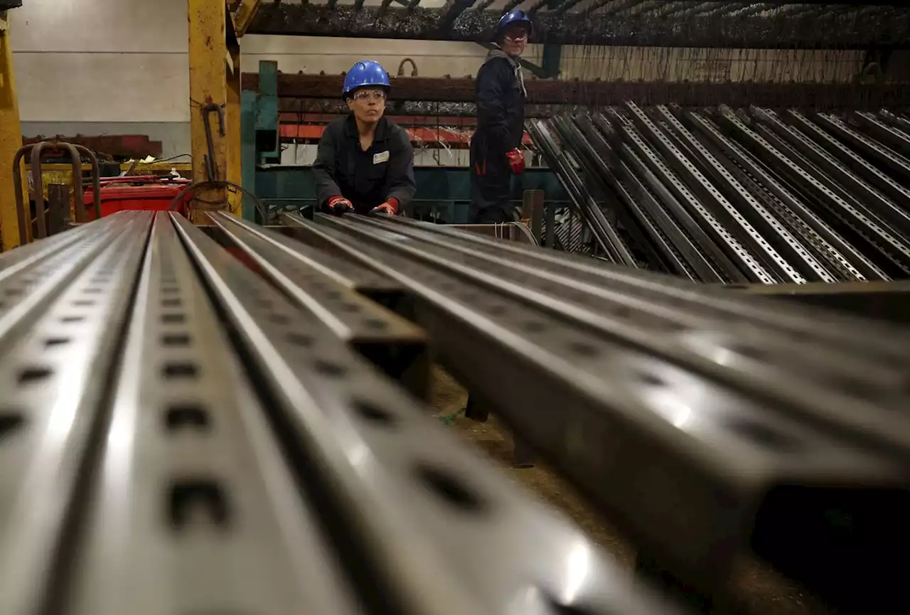 British factory output falls for first time since February 2021, survey shows