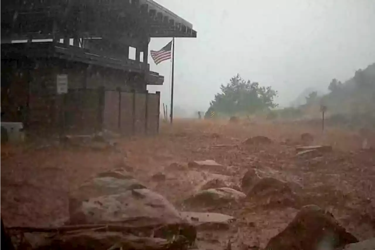 Arizona levee breached, hiker missing after floods hit West