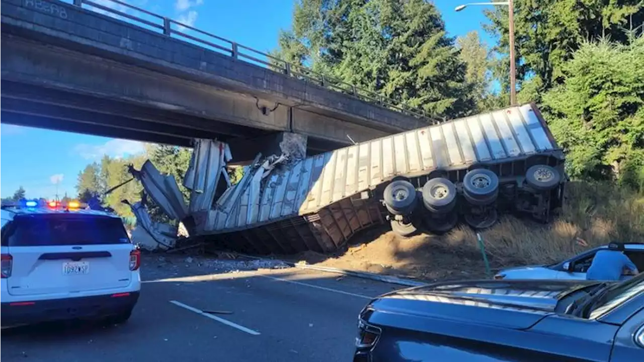 Miles-long backup on I-5 South near Tumwater after semitruck crashes into overpass, killing driver