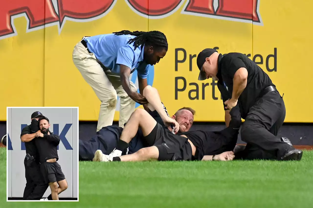 Fan on field interrupts Subway Series game