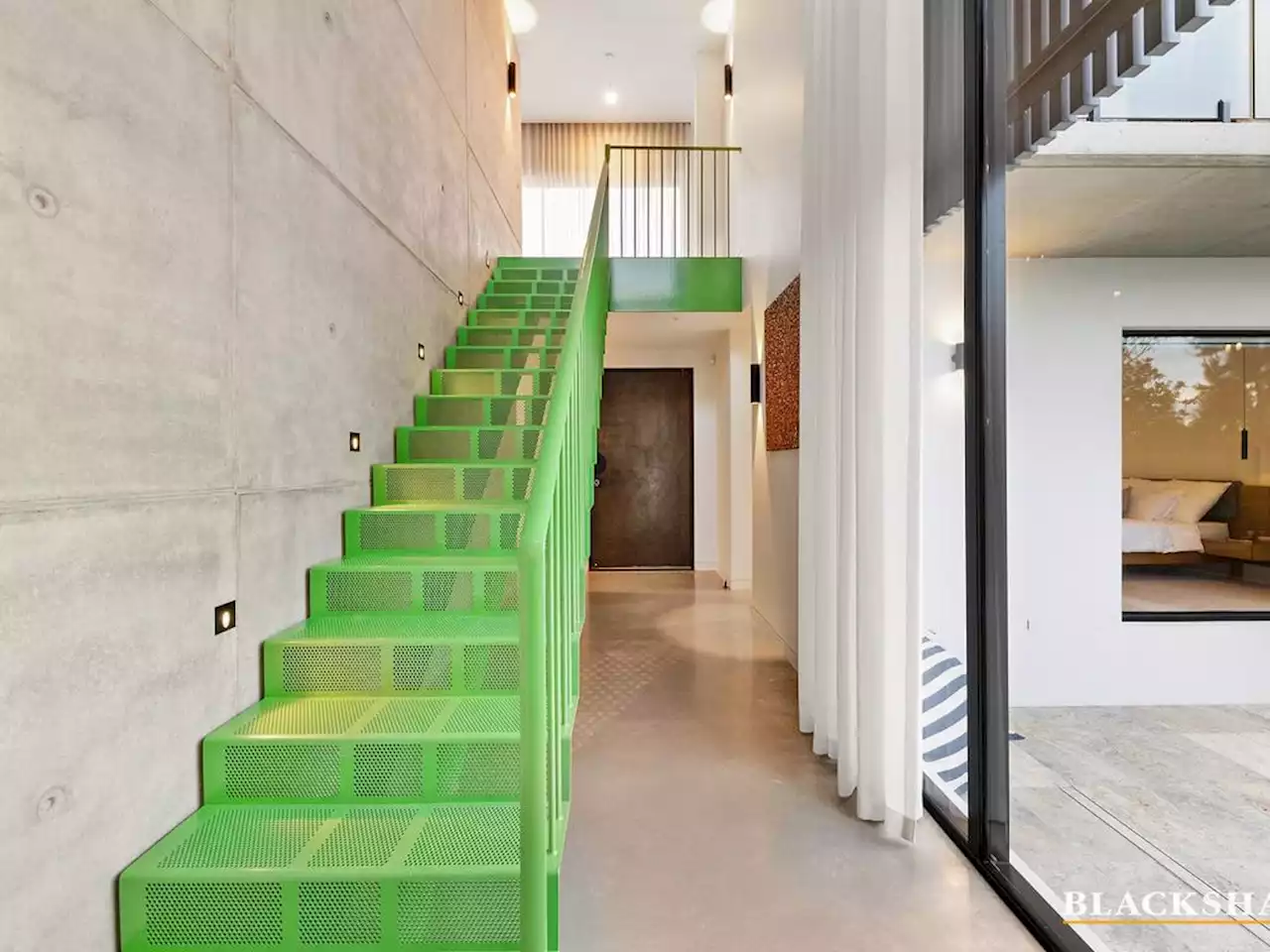 Extroverted Griffith home with Kelly-green staircase ‘encourages opinion’ - realestate.com.au