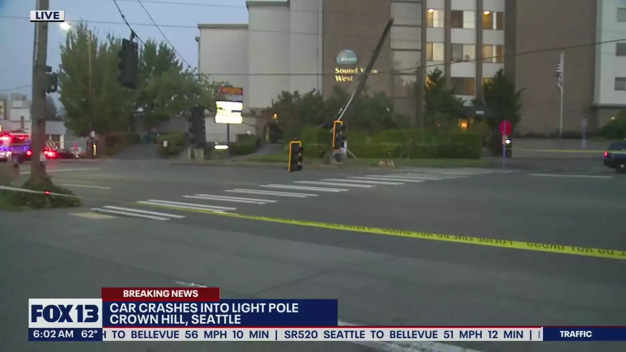 Car hits, knocks over utility pole in Seattle