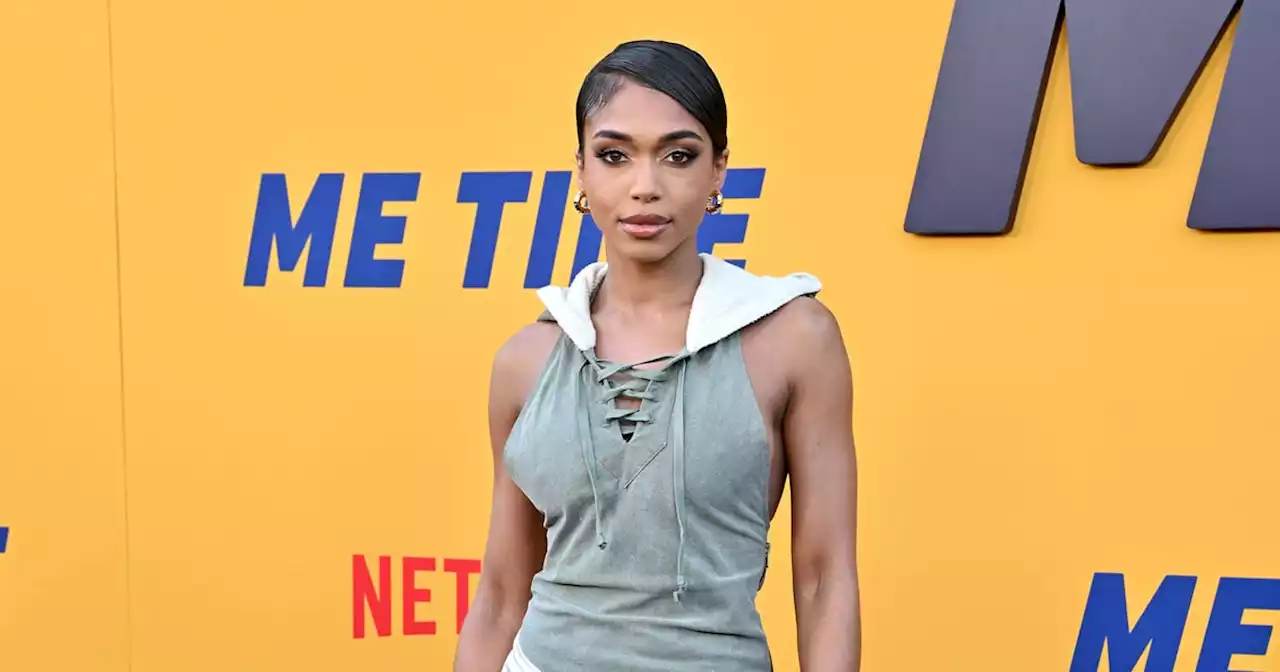 Lori Harvey Pulls Off a Hooded Slip Dress With a High Slit