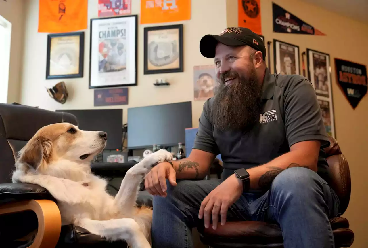 Smith: How a veteran with PTSD found life-saving dog, love for Astros