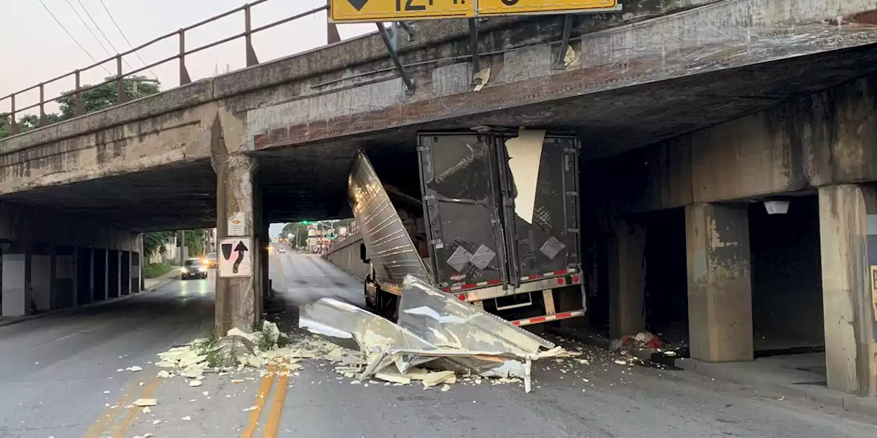 Semitrailer fails to clear bridge; city planning more signage for truckers, officials say