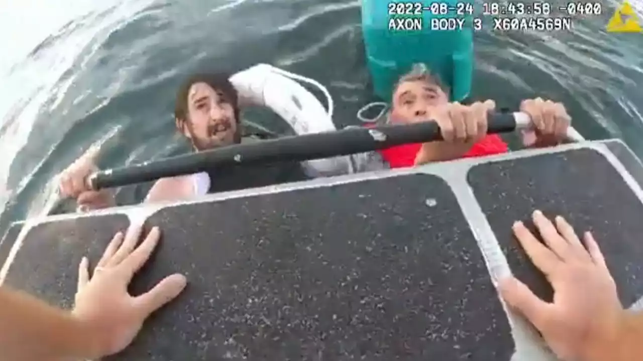 Father and son found clinging to cool box as video shows dramatic rescue from sinking boat near Boston Harbor