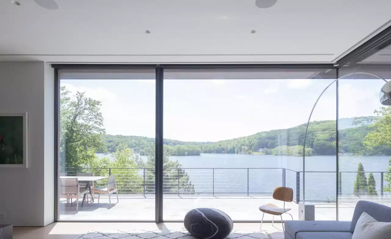 This Connecticut lake house by Worrell Yeung cascades towards the water