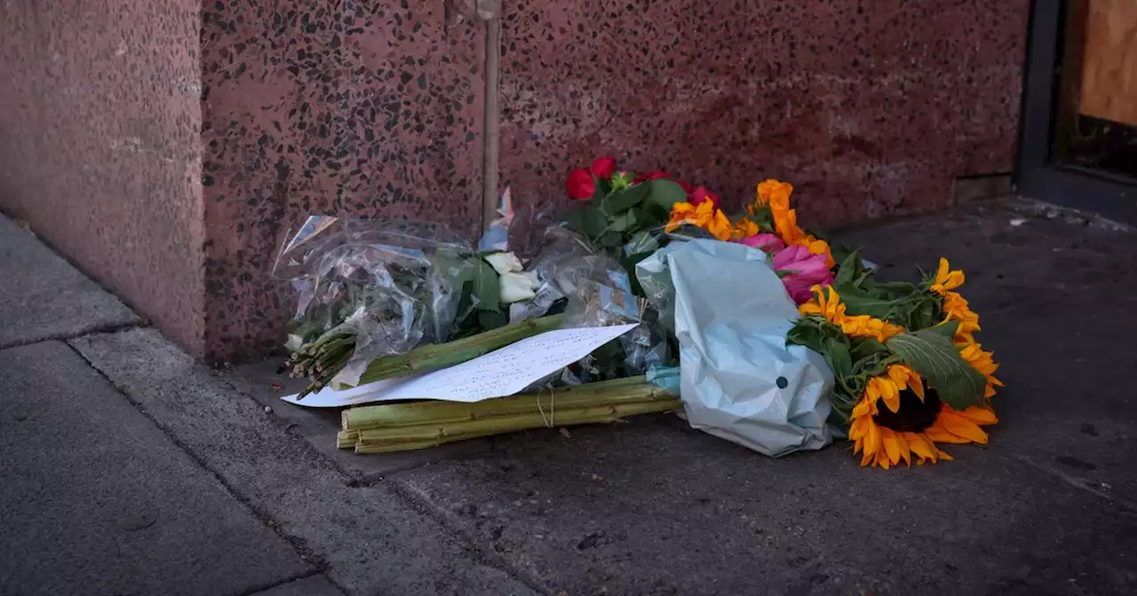 Floral tributes left after man's death outside city apartment